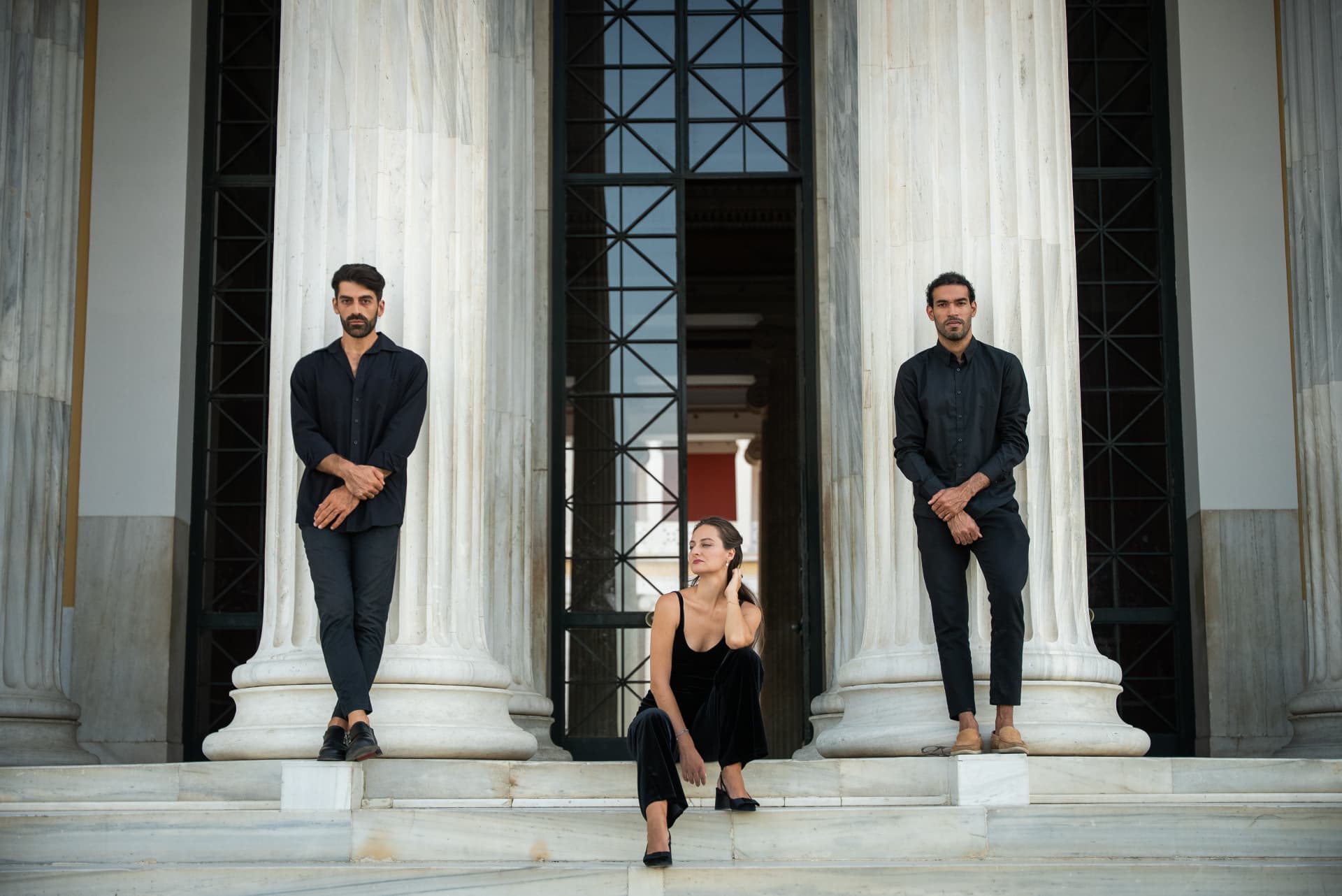 The Palintonos Trio between marble columns